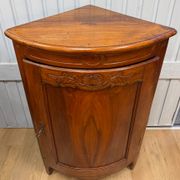 Corner cabinet in walnut in the Louis XV style.