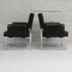 Paire de fauteuils piètement inox, simili-cuir noir, France, circa 1970