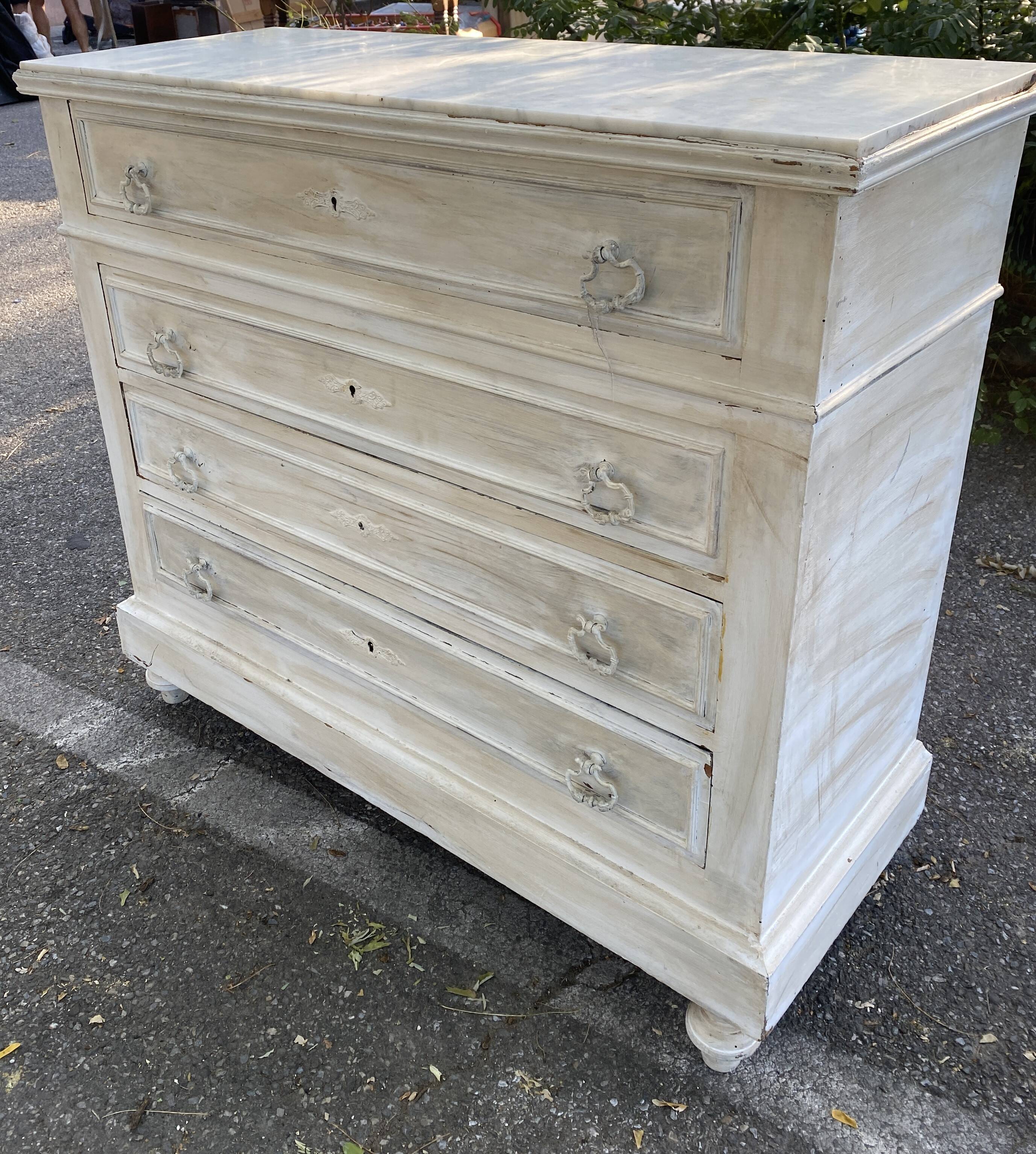 Old chest of drawers in bleached wood with white marble top