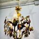 Lustre en fer forgé et porcelaine