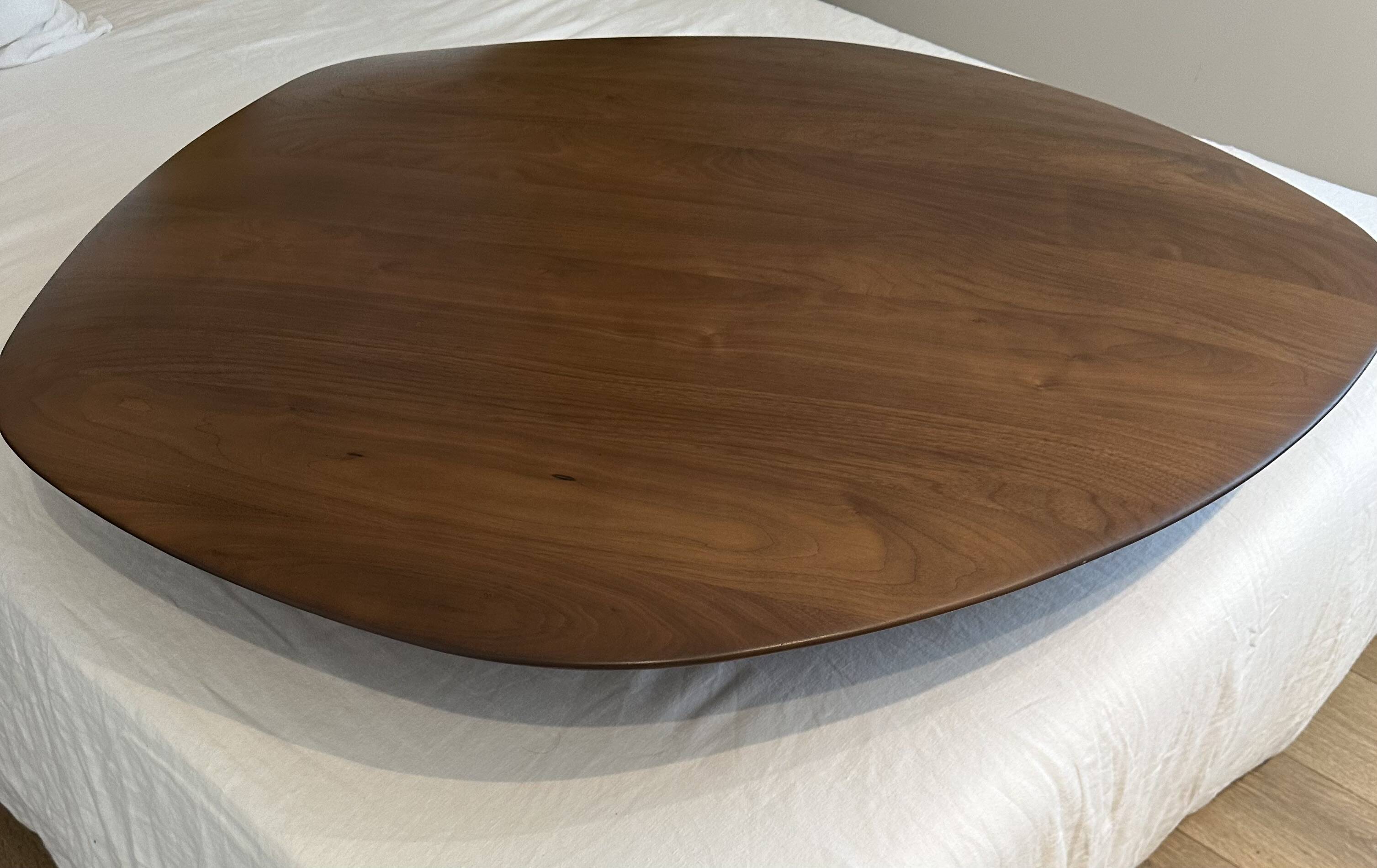 Pebble coffee table with a convex top by Cinna.