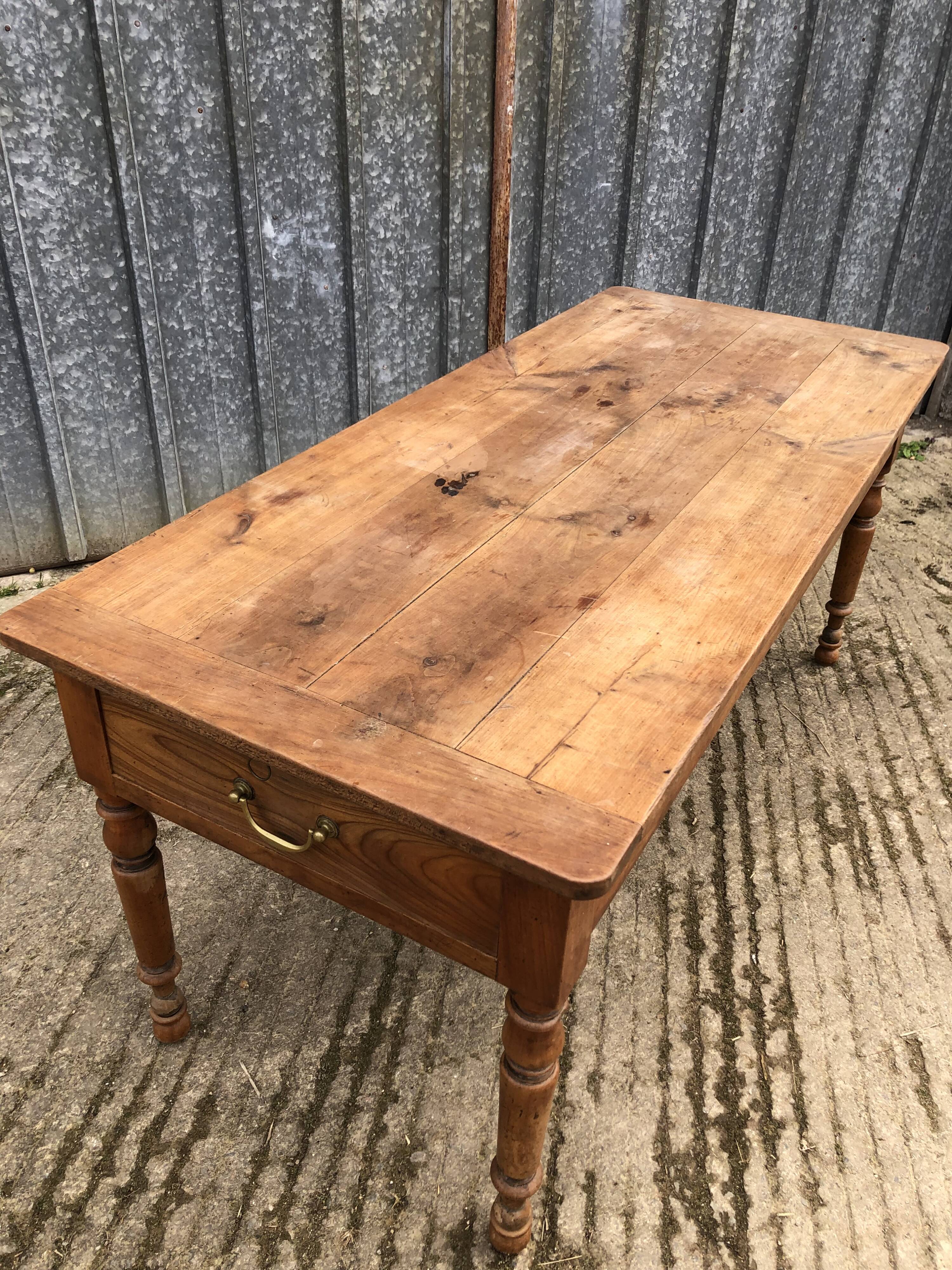 Antique cherry farmhouse table with 2 drawers and 1 pull-out