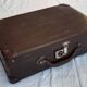 Small old suitcase with a ribbed appearance