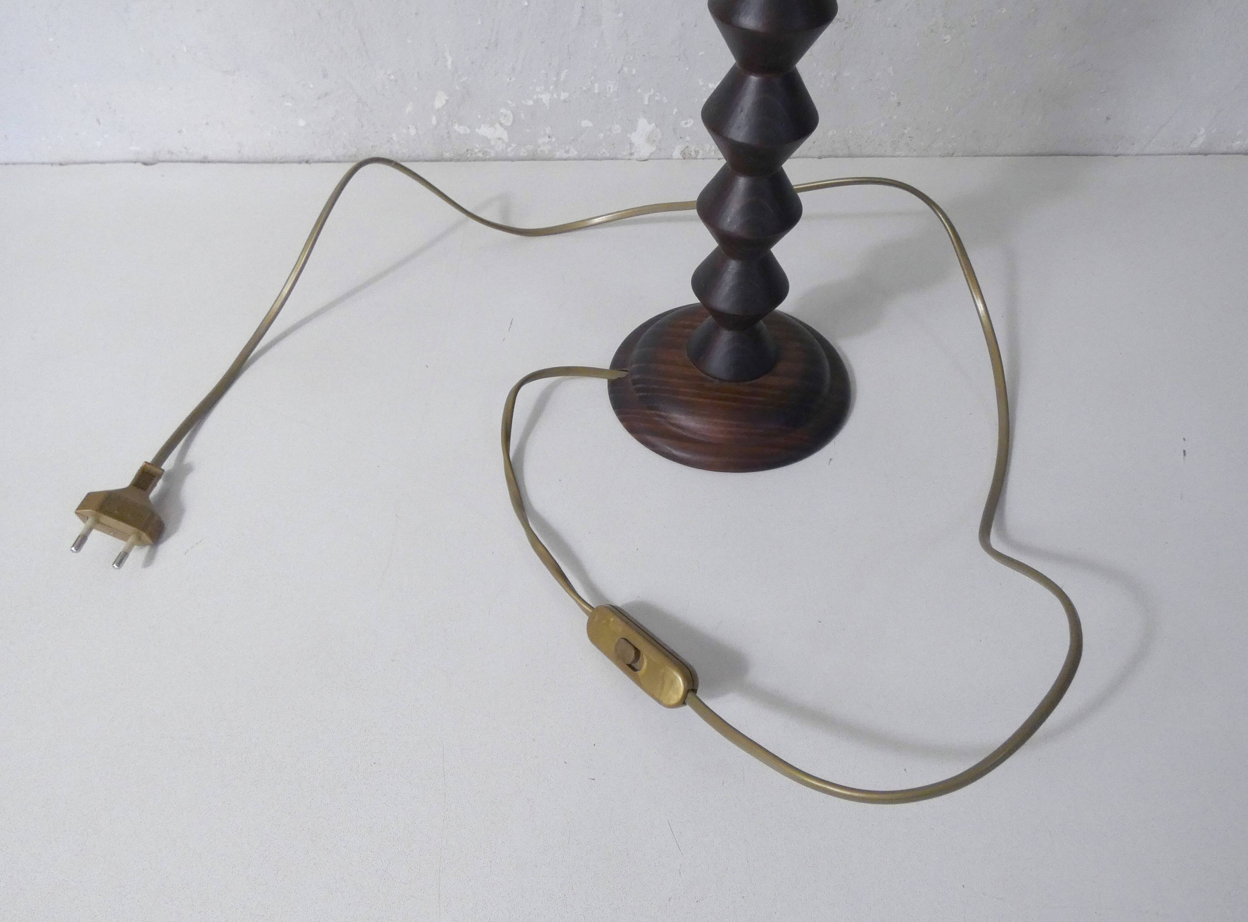 turned wooden lamp with spool base and vintage copper shade