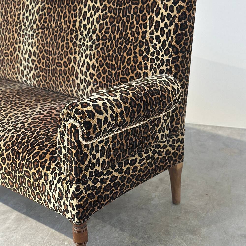 Vintage leopard velvet sofa / wall sofa with drop-down arms, France.