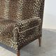 Vintage leopard velvet sofa / wall sofa with drop-down arms, France.
