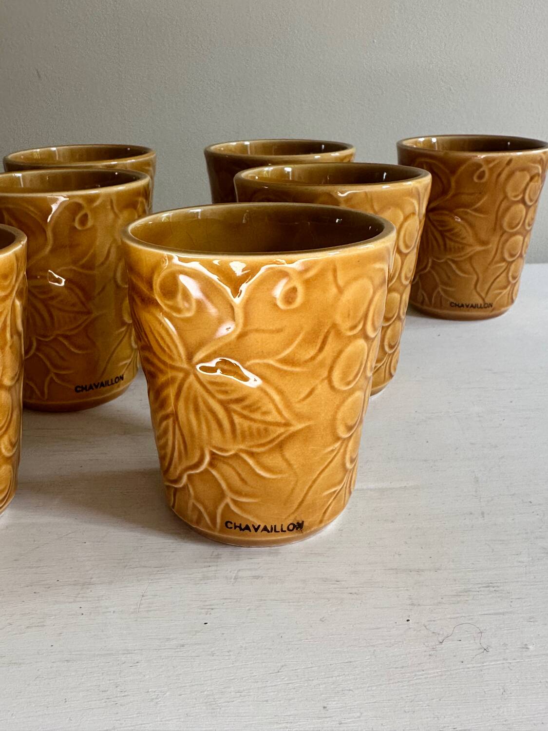 Set of 12 ochre Chavaillon de Sarreguemines cups