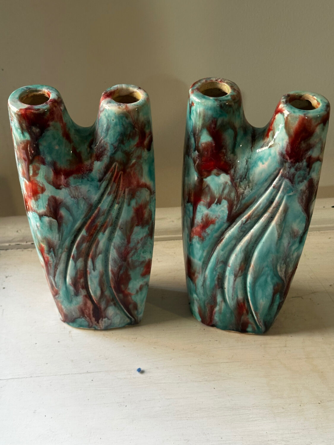 Vintage pair of turquoise and red ceramic candlesticks
