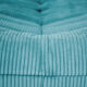 Ensemble de fauteuil et pouf Togo en velours côtelé bleu clair.