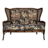 Wingback 2-seater sofa in carved wood, cane and fabric