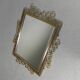 Vintage faceted mirror in an aluminium frame
