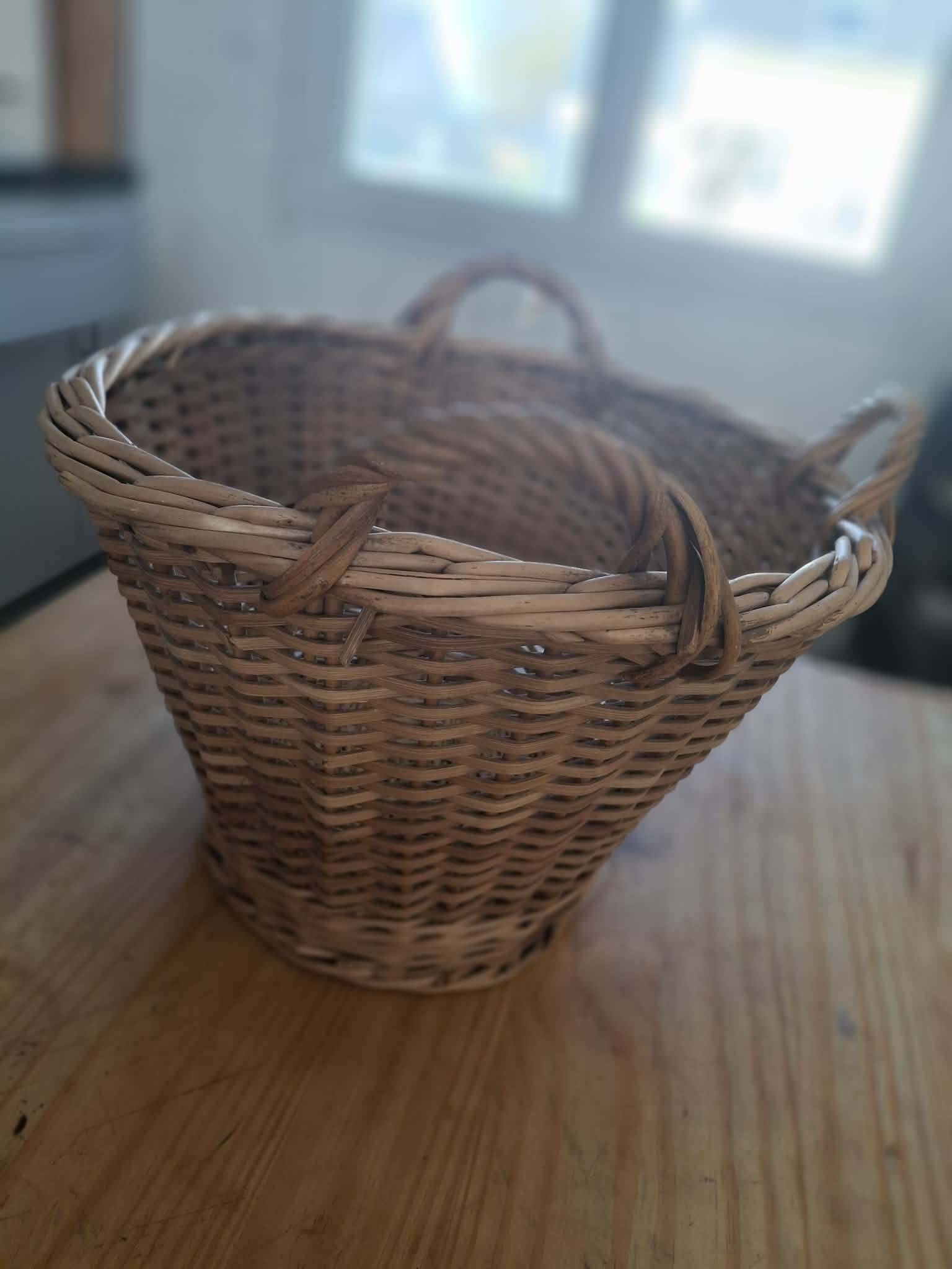 Old wicker basket with 3 handles.