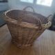 Old wicker basket with 3 handles.