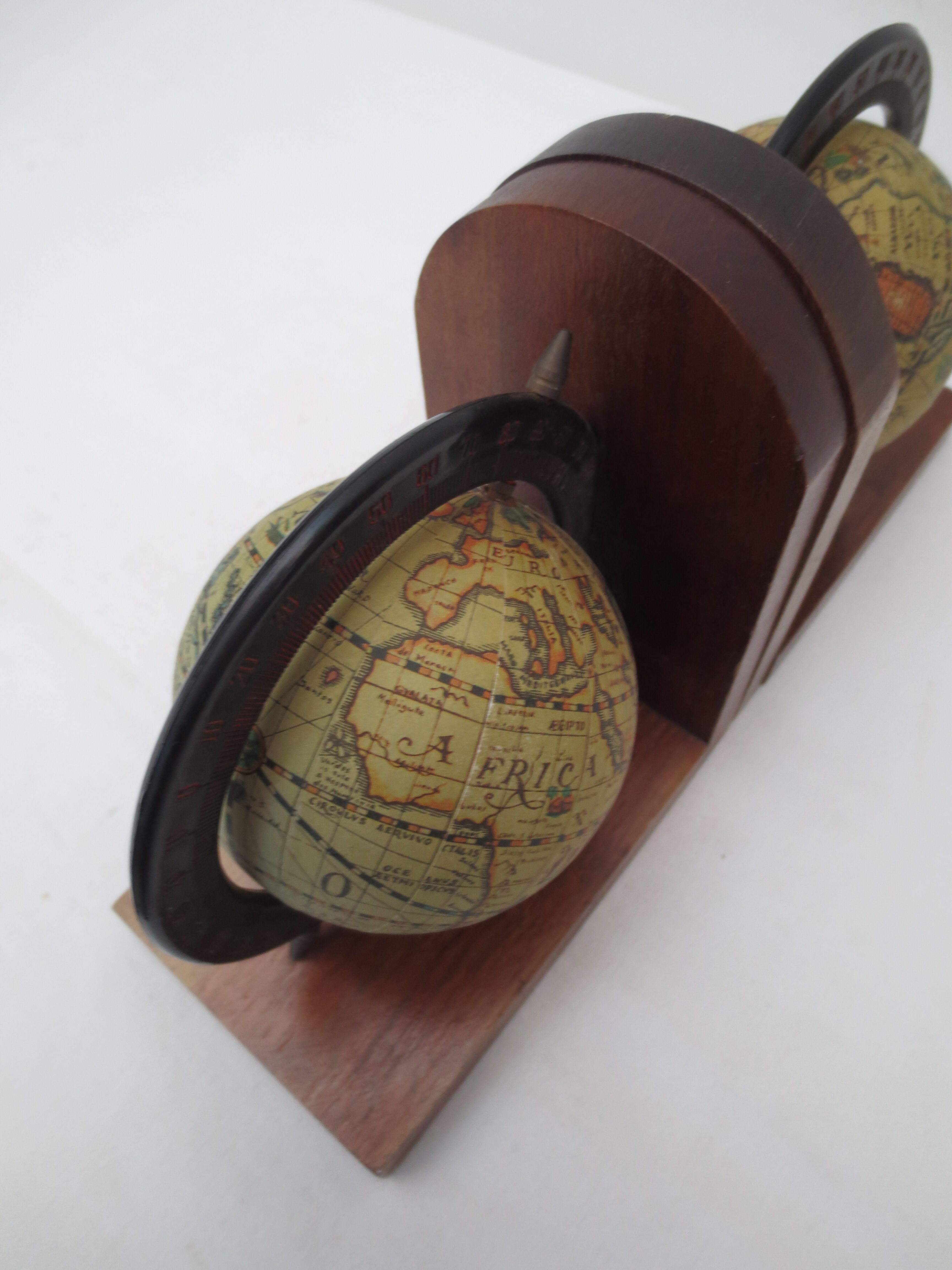 Old pair of greenhouse books in solid wood and world map