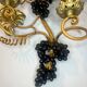 Large pair of wall sconces with vine decorations.
