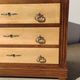 Old chest of drawers with white marble.