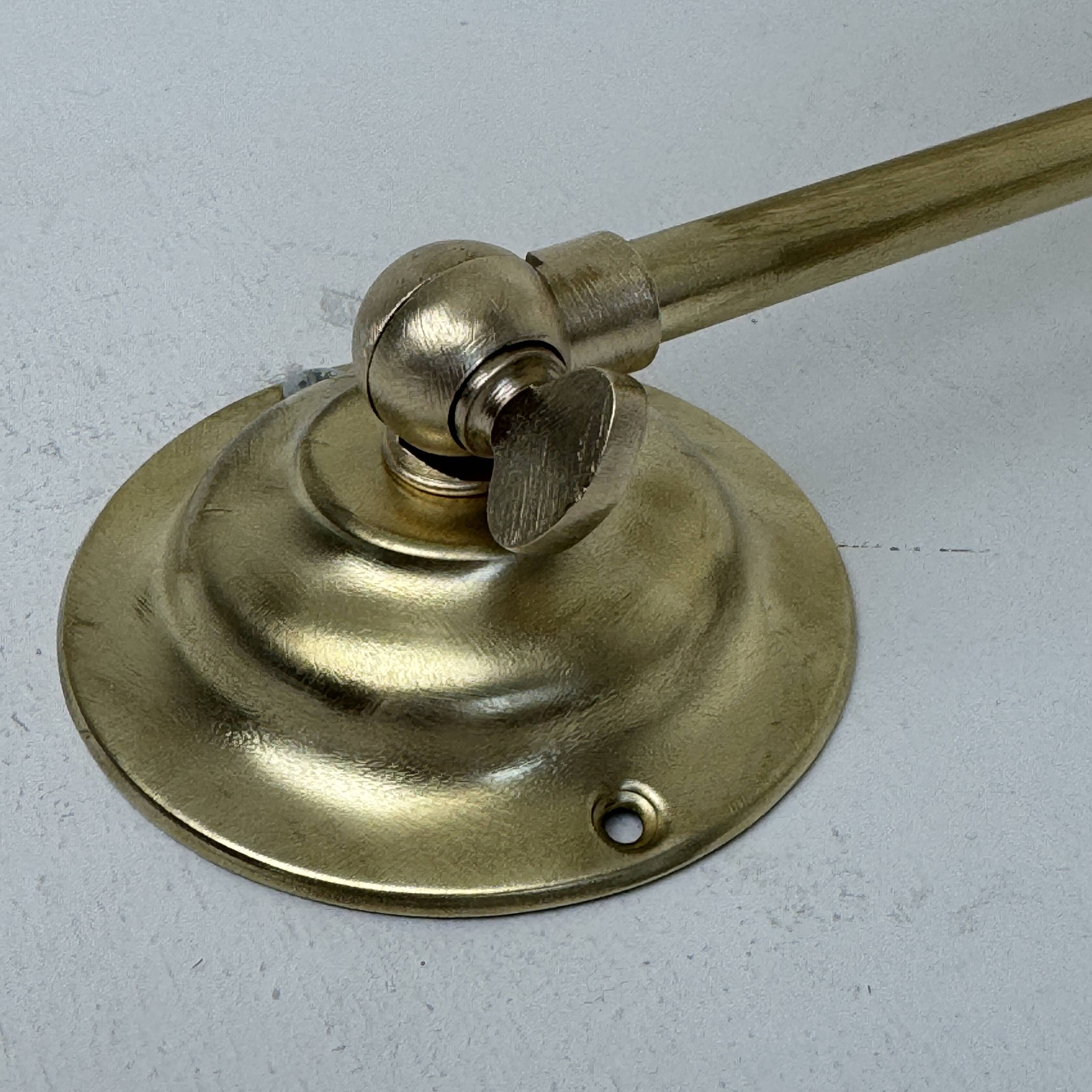 A pair of vintage opaline and brass wall lights