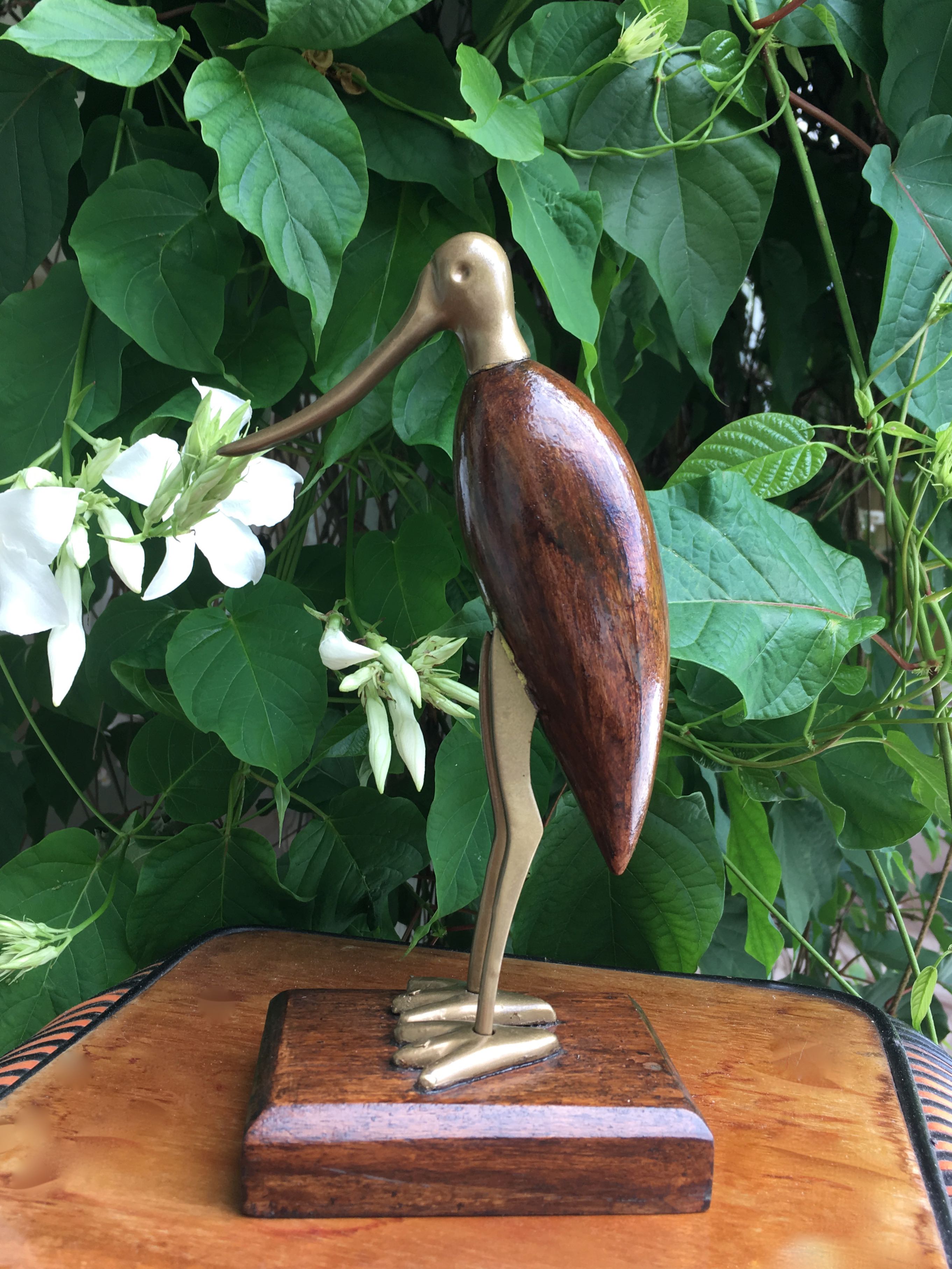 Animal marabout in teak and brass