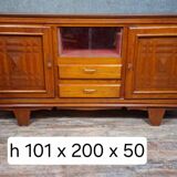 Low buffet in carved oak, Art Deco style, circa 1930.