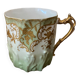 Extra fine porcelain cup pale green decorations and gilding