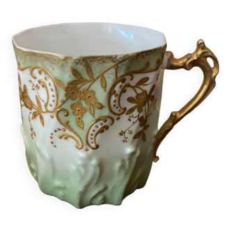 Extra fine porcelain cup pale green decorations and gilding