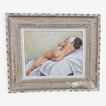 Oil on canvas art deco period depicting a nude from behind signature lower right to decipher