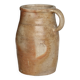 Old rustic stoneware jar with handle