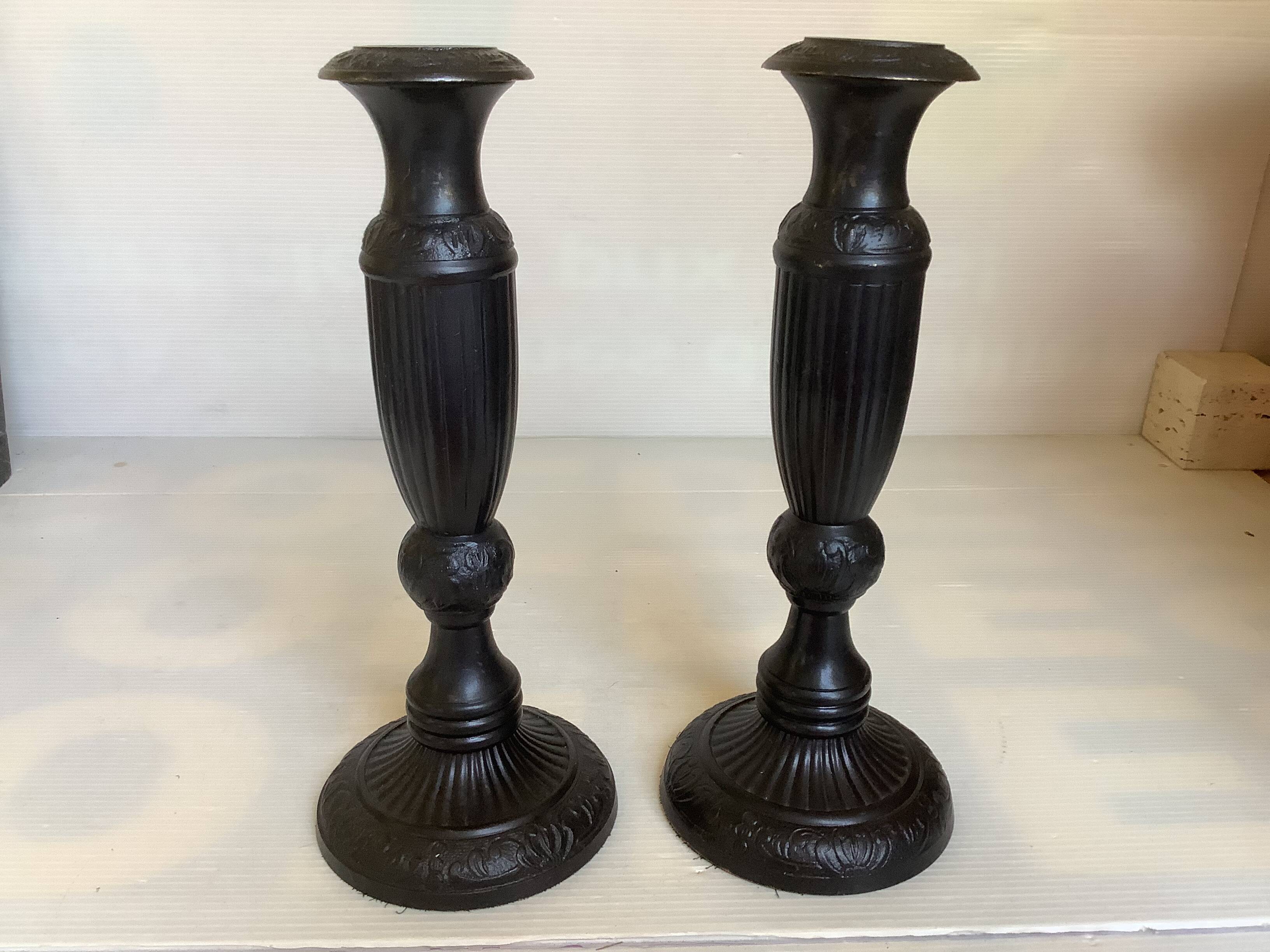 Pair of large black metal candlesticks