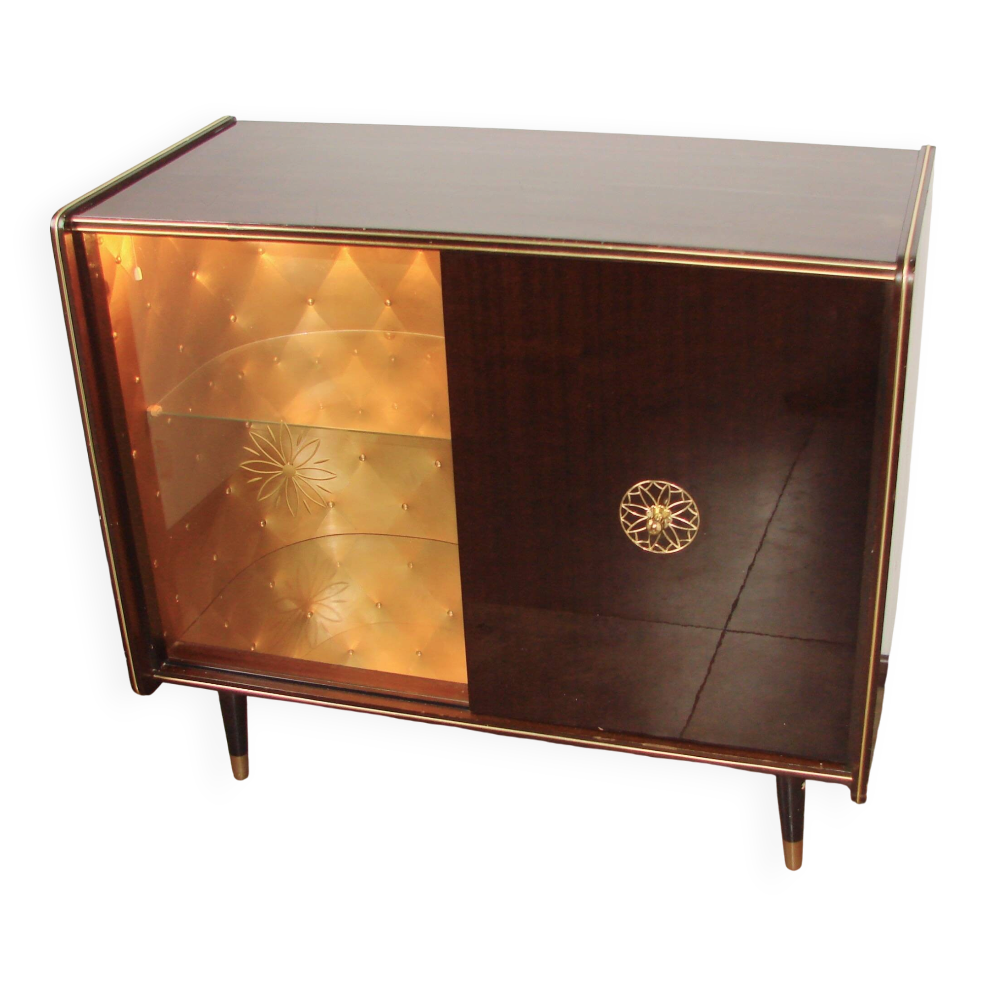 A vintage cabinet with a record player and a bar, 1960s.
