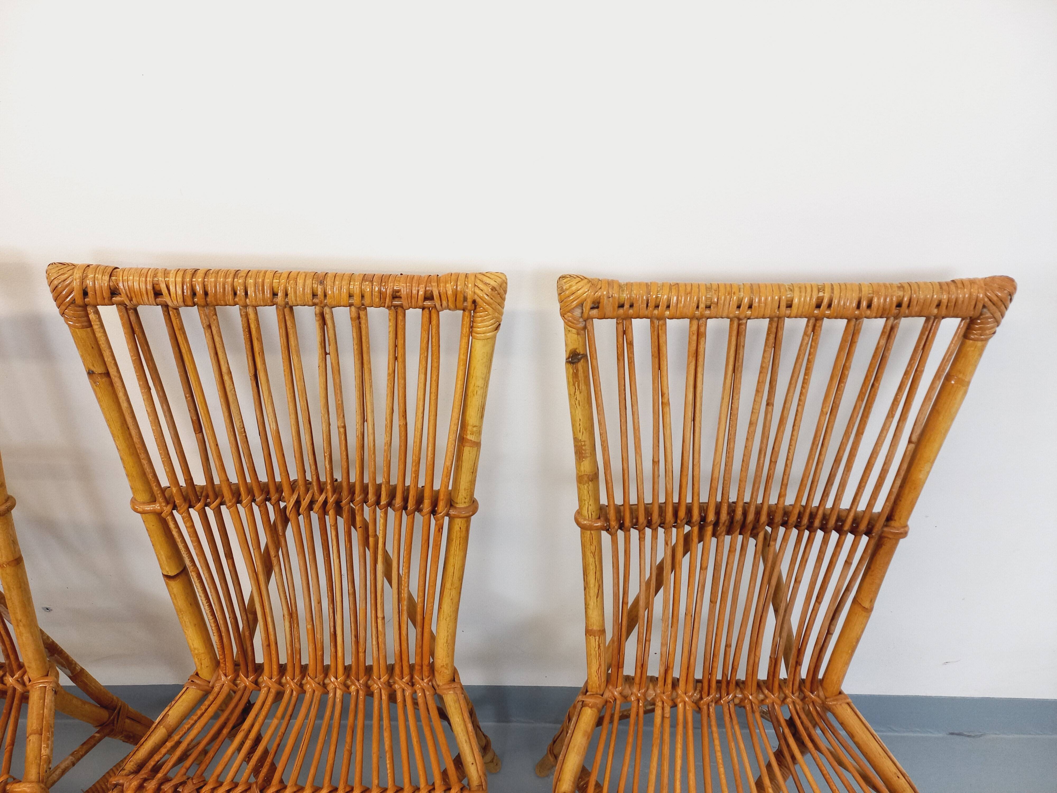 Set of 4 vintage Audoux Minet rattan chairs from the 1950s and 60s.