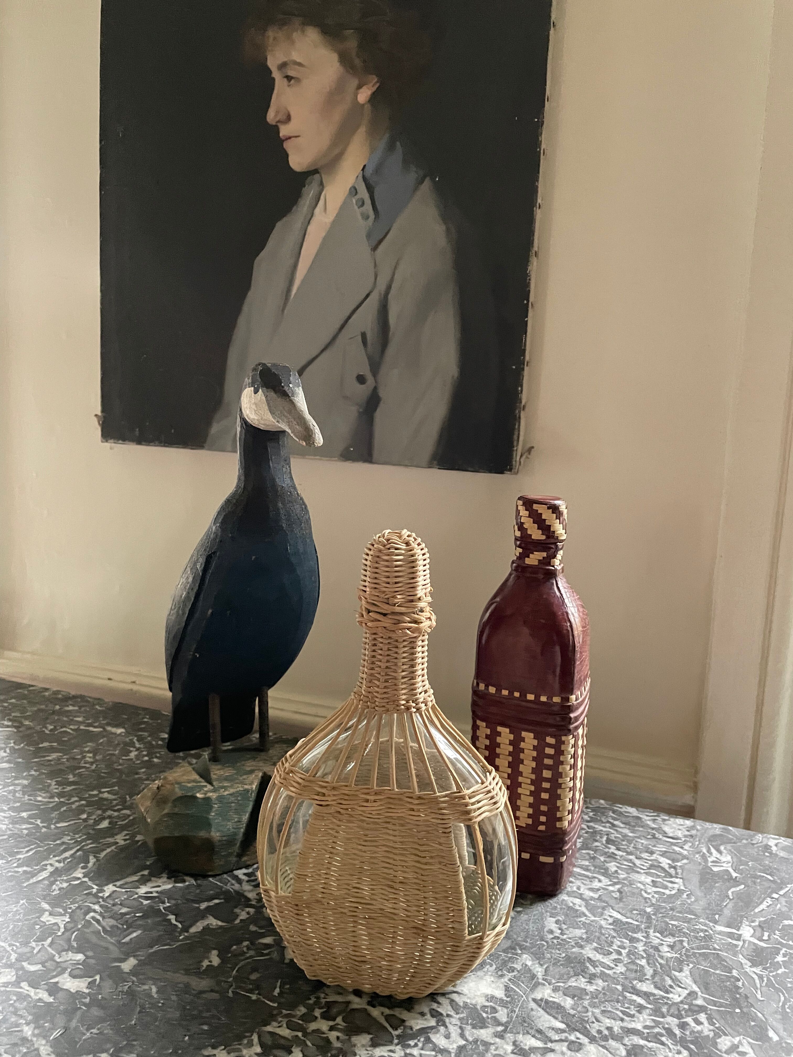 Wicker-sheathed glass bottle