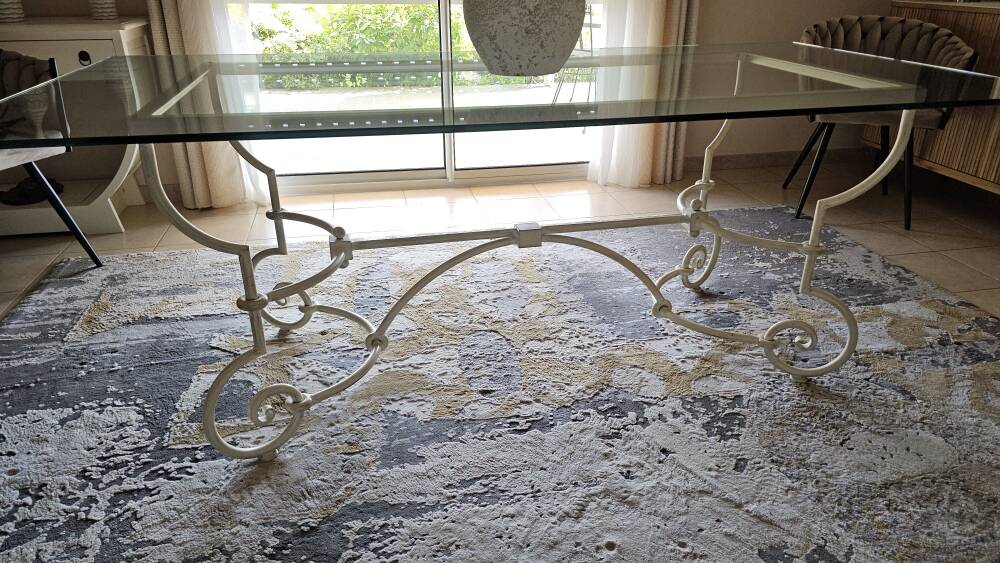 Wrought iron table by Roche Bobois, with a glass top.