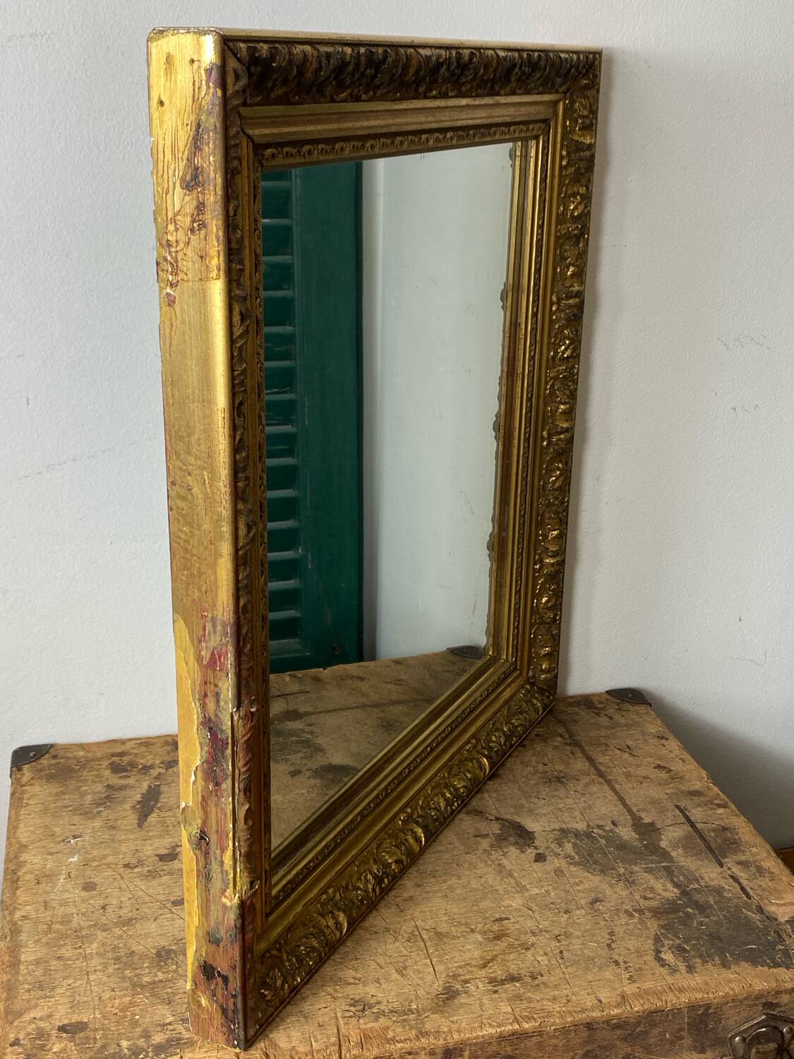 Antique mirror in carved gilded wood