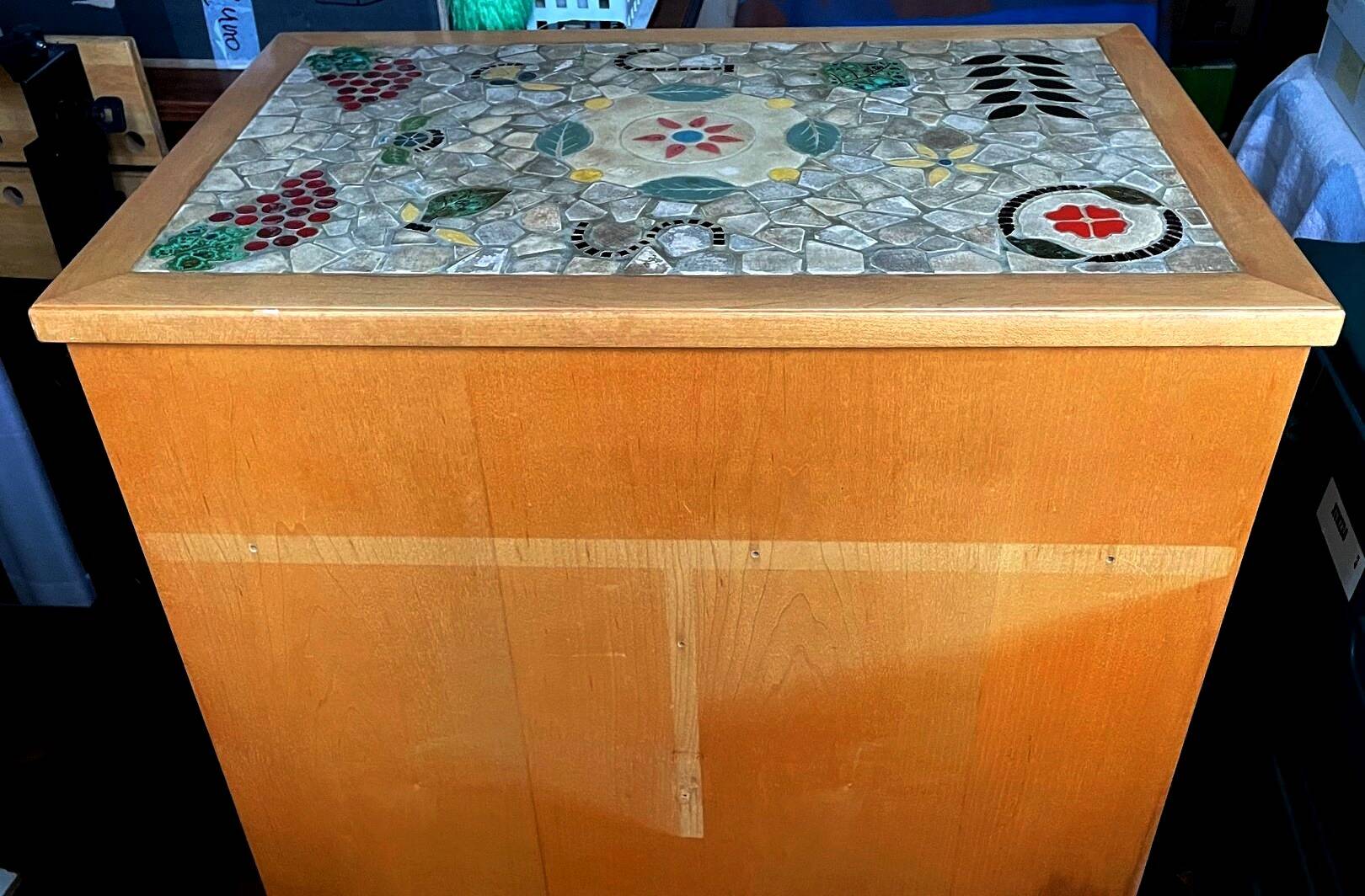 New oak storage furniture with a signed artisanal mosaic top.