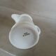 2 small white porcelain pitchers