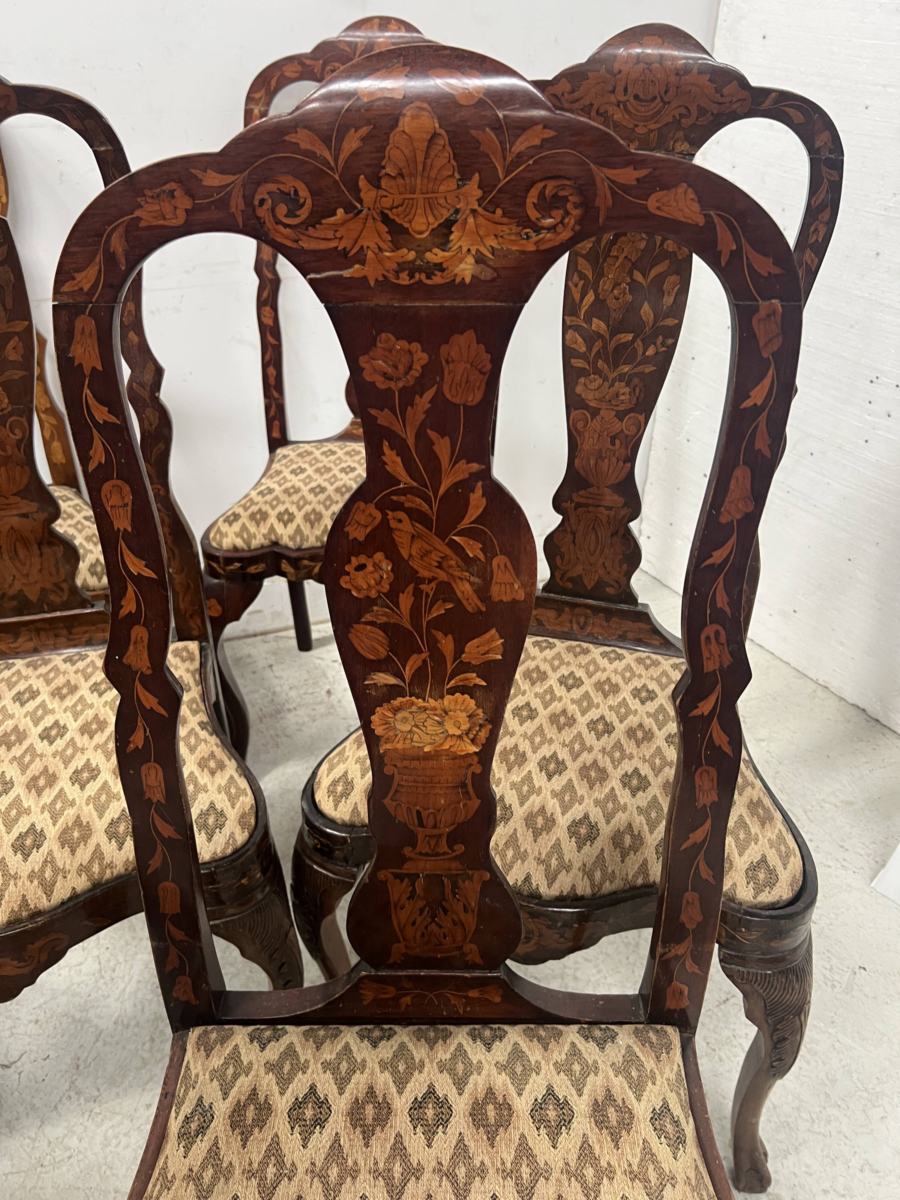 Set of eight Dutch marquetry chairs from the 19th century.