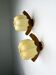 Pair of "Cocoon" wall lights, resin and pine, Italy, 1970s