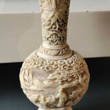 Asian-inspired ball vase. In beige cinnabar lacquer. Scenes of life decor. Arabesque and floral friezes. Height 24 cm