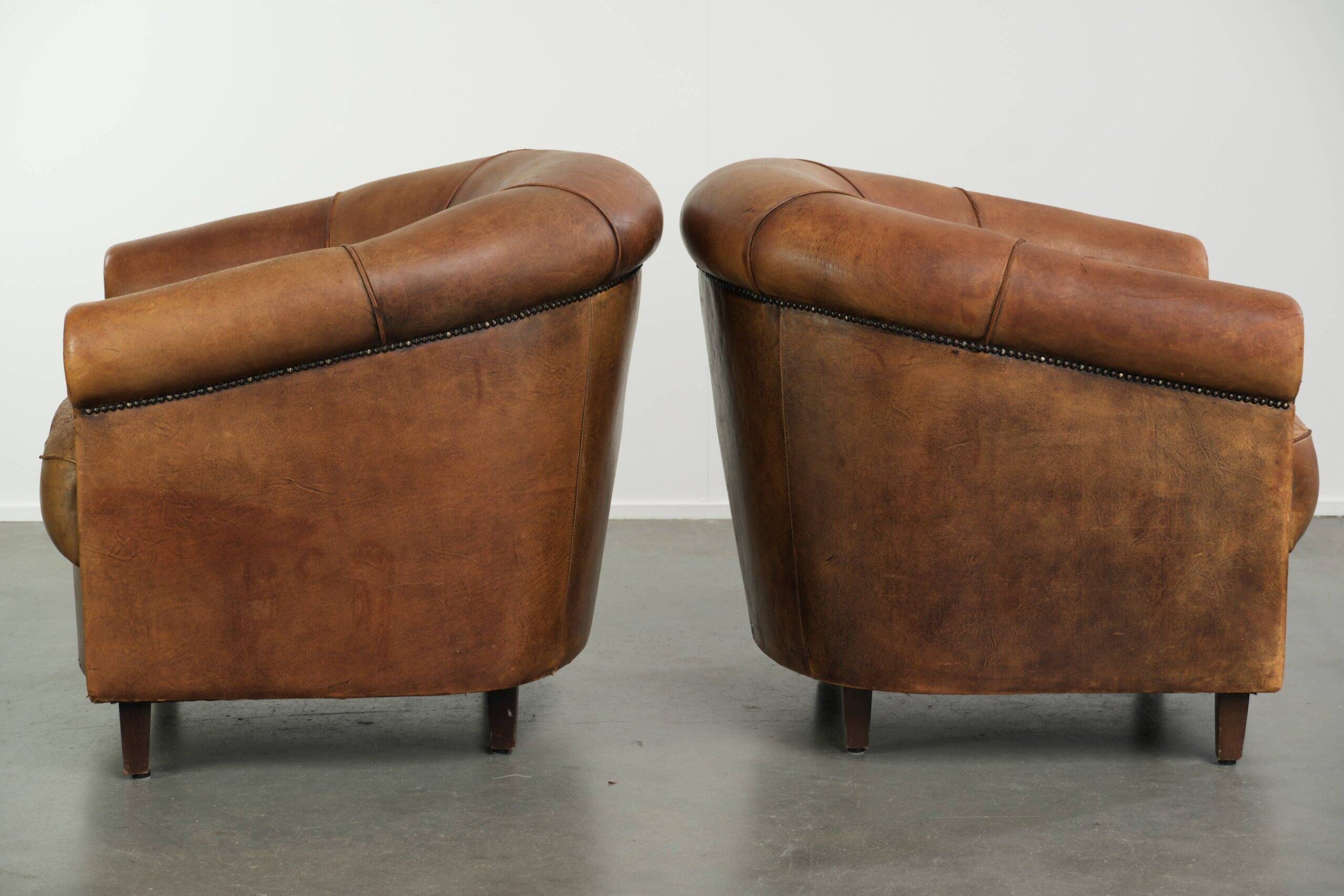 Sturdy set of vintage sheepskin club armchairs with a great appearance