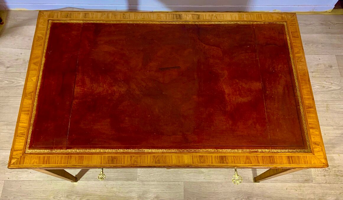Louis XVI style desk in precious wood marquetry and gilded bronzes