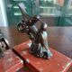 Zinc art bookends in the shape of birds on red marble - warblers