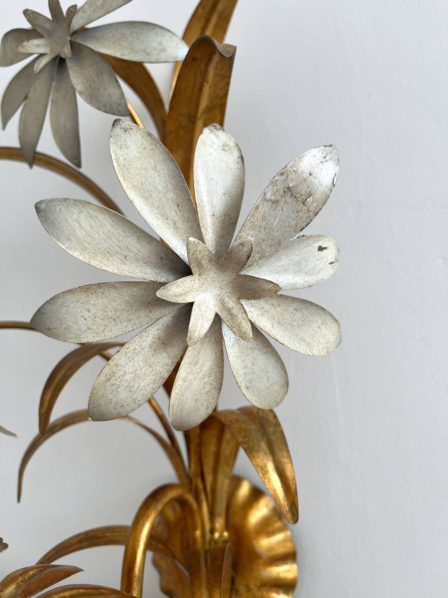 Vintage Hollywood Regency gold metal leaf wall sconce.