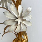 Vintage Hollywood Regency gold metal leaf wall sconce.