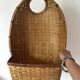 Woven rattan basket, for placing or hanging.