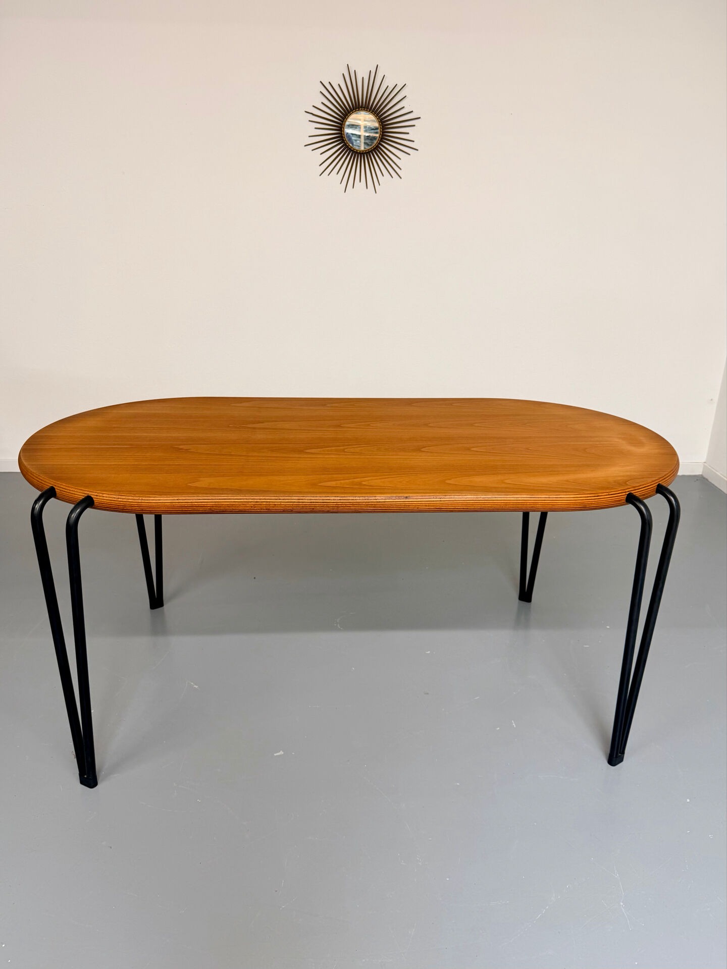 Solid wood dining table with tubular legs, 1980s postmodern design.
