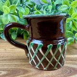 Small vintage ceramic jug in brown glazed with geometric design.