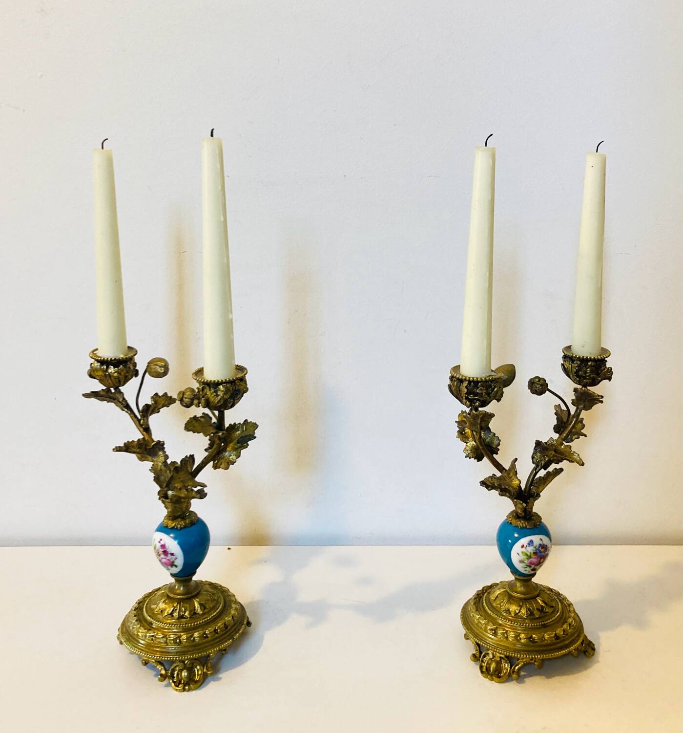 19th century candle holders in gilded bronze and porcelain