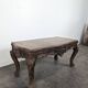 Louis XV coffee table in carved walnut with a gilded leather top.