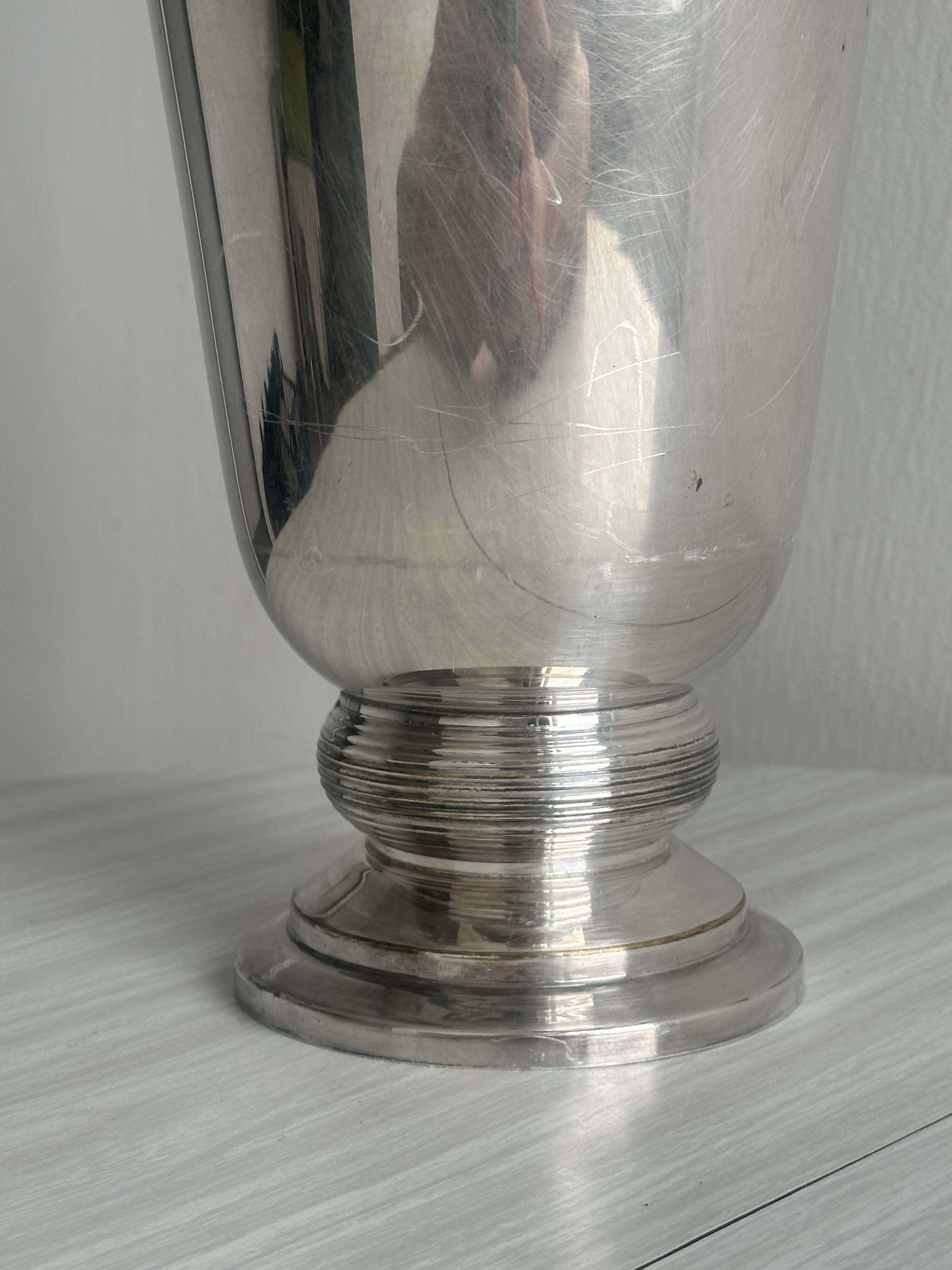 Antique shiny metal vase