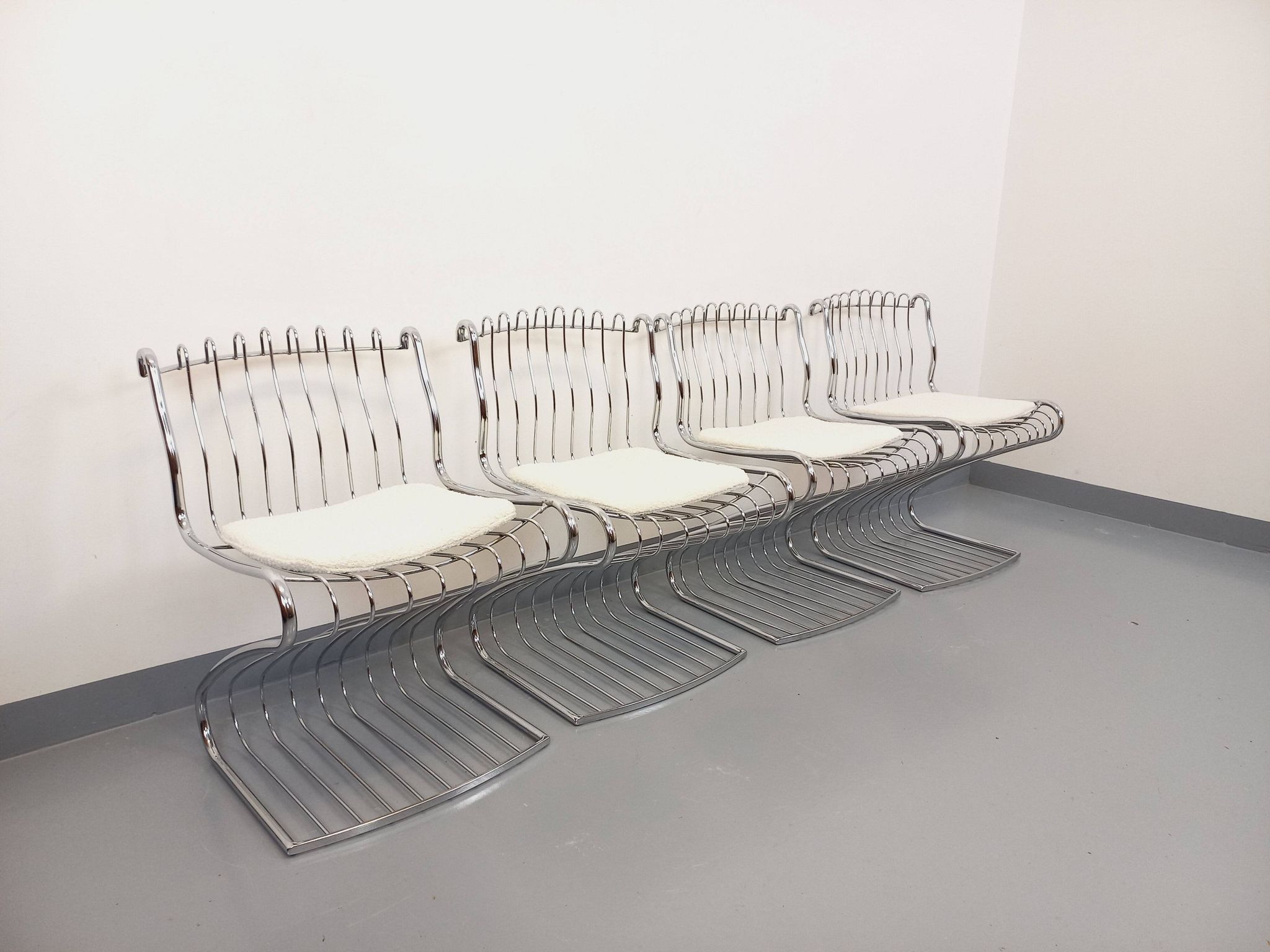 Set of 4 vintage Italian chairs by Gastone Rinaldi in chrome metal.